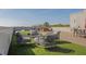 Inviting outdoor rooftop lounge area with chairs, table, and artificial turf at 112 Rogers Ne St # 207, Atlanta, GA 30317