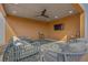 Covered area on the roof deck with a ceiling fan, TV, and cozy seating on an outdoor rug at 112 Rogers Ne St # 207, Atlanta, GA 30317