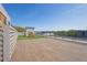 Expansive roof deck featuring outdoor fireplace and lounge area with wooden chairs and tile flooring at 112 Rogers Ne St # 207, Atlanta, GA 30317