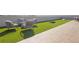 Inviting rooftop lounge area with comfortable seating and outdoor games on artificial turf at 112 Rogers Ne St # 207, Atlanta, GA 30317