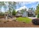 Large backyard with a play structure, patio, and plenty of green space for outdoor activities at 1861 8Th St, Atlanta, GA 30341