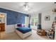 Bright bedroom featuring playful decor, a single bed, and large window with natural light at 1861 8Th St, Atlanta, GA 30341