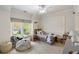 Well-lit room features a cozy daybed and a sunny window offering a pleasant view at 1861 8Th St, Atlanta, GA 30341