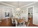 Dining room with wood table and six chairs beneath decorative chandelier at 1861 8Th St, Atlanta, GA 30341