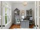 Home office with grey desk and cabinets with natural lighting at 1861 8Th St, Atlanta, GA 30341