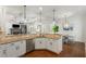 Bright kitchen with granite countertops, stainless steel appliances, and open concept design to the living room at 1861 8Th St, Atlanta, GA 30341