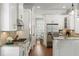 Galley style kitchen with stainless steel appliances and white cabinets at 1861 8Th St, Atlanta, GA 30341