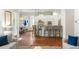Open-concept living room featuring hardwood floors, a kitchen island, and plenty of natural light at 1861 8Th St, Atlanta, GA 30341