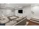 Spacious living room features a large sectional sofa and hardwood floors, creating a cozy atmosphere at 1861 8Th St, Atlanta, GA 30341