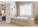Soaking tub next to window in main bathroom at 1861 8Th St, Atlanta, GA 30341