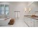 Stylish bathroom with a soaking tub, herringbone tile floor, and modern vanity at 645 Iroquois Ne Dr, Marietta, GA 30060