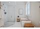 Bright, luxurious bathroom with a walk-in shower, soaking tub, and modern fixtures at 645 Iroquois Ne Dr, Marietta, GA 30060
