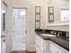 Modern bathroom with white subway tiles in shower, black granite countertop, and stylish vanity at 645 Iroquois Ne Dr, Marietta, GA 30060