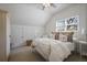 Cozy bedroom with soft carpet, a comfortable bed, and natural light from a large window at 645 Iroquois Ne Dr, Marietta, GA 30060
