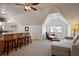 Spacious bonus room with carpet, a wet bar, and a seating area with lots of light at 645 Iroquois Ne Dr, Marietta, GA 30060