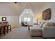 Bright bonus room features a wet bar, comfortable seating, and lots of natural light at 645 Iroquois Ne Dr, Marietta, GA 30060
