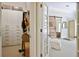 Spacious walk-in closet featuring custom shelving and ample storage, connecting to room with sliding barn door at 645 Iroquois Ne Dr, Marietta, GA 30060