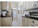 Bright kitchen area with custom cabinets, granite countertops, and stainless-steel appliances at 645 Iroquois Ne Dr, Marietta, GA 30060