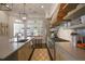 Bright, stylish kitchen with stone countertops, modern appliances, and open shelving at 645 Iroquois Ne Dr, Marietta, GA 30060