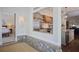 A pass-through window shows the eat-in kitchen with stainless appliances and light gray cabinetry at 645 Iroquois Ne Dr, Marietta, GA 30060