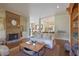 Elegant living room showcasing a brick fireplace, hardwood floors, and stylish furnishings at 645 Iroquois Ne Dr, Marietta, GA 30060
