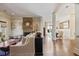 Spacious living area with brick fireplace, hardwood floors, and open flow to the dining room at 645 Iroquois Ne Dr, Marietta, GA 30060