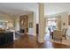 Open-concept living room flowing into the dining area, featuring hardwood floors and stylish decor at 645 Iroquois Ne Dr, Marietta, GA 30060