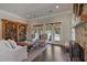 Bright living room featuring hardwood floors, built-in bookcase, and a cozy fireplace at 645 Iroquois Ne Dr, Marietta, GA 30060