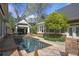 Inviting backyard pool surrounded by lush landscaping, perfect for relaxation at 645 Iroquois Ne Dr, Marietta, GA 30060