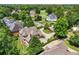 Aerial view of a brick home with mature trees at 6935 Wakehurst Pl, Cumming, GA 30040