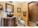 Stylish bathroom featuring a vessel sink, granite countertop, and tiled walk-in shower at 6935 Wakehurst Pl, Cumming, GA 30040