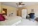 Comfortable bedroom featuring a dedicated workspace, large bed, and ample storage at 6935 Wakehurst Pl, Cumming, GA 30040