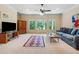 Spacious living room featuring natural light and comfortable seating at 6935 Wakehurst Pl, Cumming, GA 30040