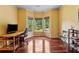 Sunlit home office with hardwood flooring, great natural light and beautiful views at 6935 Wakehurst Pl, Cumming, GA 30040