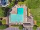 Aerial view of a swimming pool with lane markers and surrounding lounge chairs, ideal for community recreation at 6935 Wakehurst Pl, Cumming, GA 30040