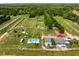 Overhead view showcasing a plant Bedroom featuring rows of plants, unique playground sets, and small buildings at 209 Brynn Ln, Mcdonough, GA 30252