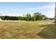 Expansive grassy backyard enclosed by a white fence, perfect for recreation and privacy at 209 Brynn Ln, Mcdonough, GA 30252