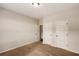 Neutral bedroom with plush carpeting and multiple doors and ample natural light at 209 Brynn Ln, Mcdonough, GA 30252