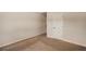 Bedroom featuring neutral paint, plush carpet, and a five panel door at 209 Brynn Ln, Mcdonough, GA 30252