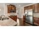 Well-equipped kitchen with granite counters, stainless steel appliances and hardwood floors at 209 Brynn Ln, Mcdonough, GA 30252