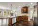 Spacious kitchen with granite countertops, stainless steel appliances and hardwood floors at 209 Brynn Ln, Mcdonough, GA 30252