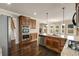 Open concept kitchen with granite countertops, stainless steel appliances, and dark hardwood floors at 209 Brynn Ln, Mcdonough, GA 30252