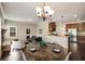 Bright living room open to kitchen with granite countertops, stainless appliances, and modern hardwood floors at 209 Brynn Ln, Mcdonough, GA 30252