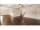 Open-concept living room with coffered ceiling, hardwood floors, and ample natural light at 209 Brynn Ln, Mcdonough, GA 30252