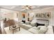 Open-concept living room with coffered ceiling, hardwood floors, and ample natural light at 209 Brynn Ln, Mcdonough, GA 30252