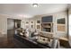 Cozy living room with stone fireplace, hardwood floors, and large windows for lots of natural light at 209 Brynn Ln, Mcdonough, GA 30252