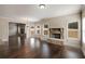 Cozy living room with stone fireplace, hardwood floors, and large windows for lots of natural light at 209 Brynn Ln, Mcdonough, GA 30252