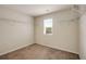 Walk-in closet with carpet flooring, wire shelving, and a window providing natural light at 209 Brynn Ln, Mcdonough, GA 30252
