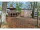 View of the back exterior with a two-story deck and covered patio area at 2763 Macby Walk, Marietta, GA 30066