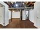 A view of the open basement area with finished floors, white walls, and access to the home's stairs at 2763 Macby Walk, Marietta, GA 30066